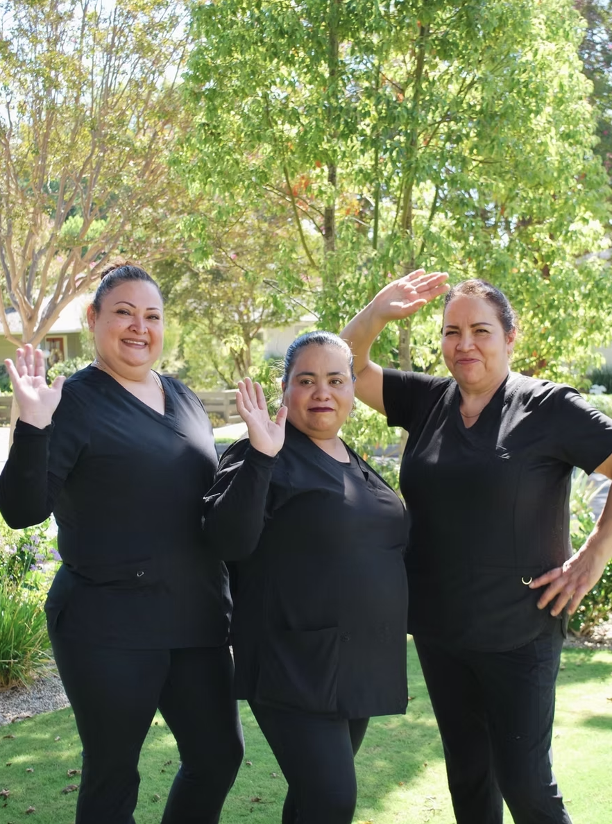 Three Kleen cleaners waving outside a Pasadena home